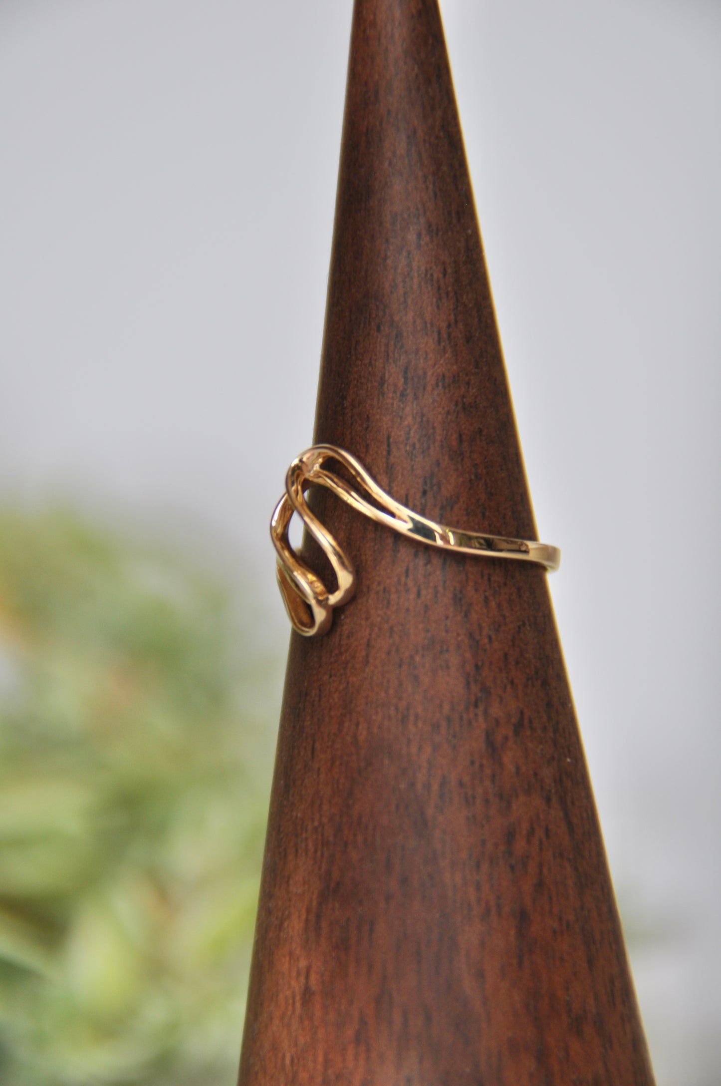Freeform shaped ring with overlapping curves in 14kt yellow gold, size 6.5