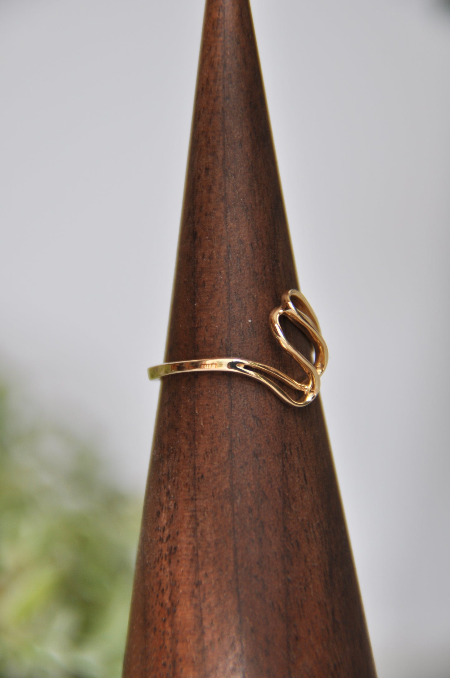 Freeform shaped ring with overlapping curves in 14kt yellow gold, size 6.5