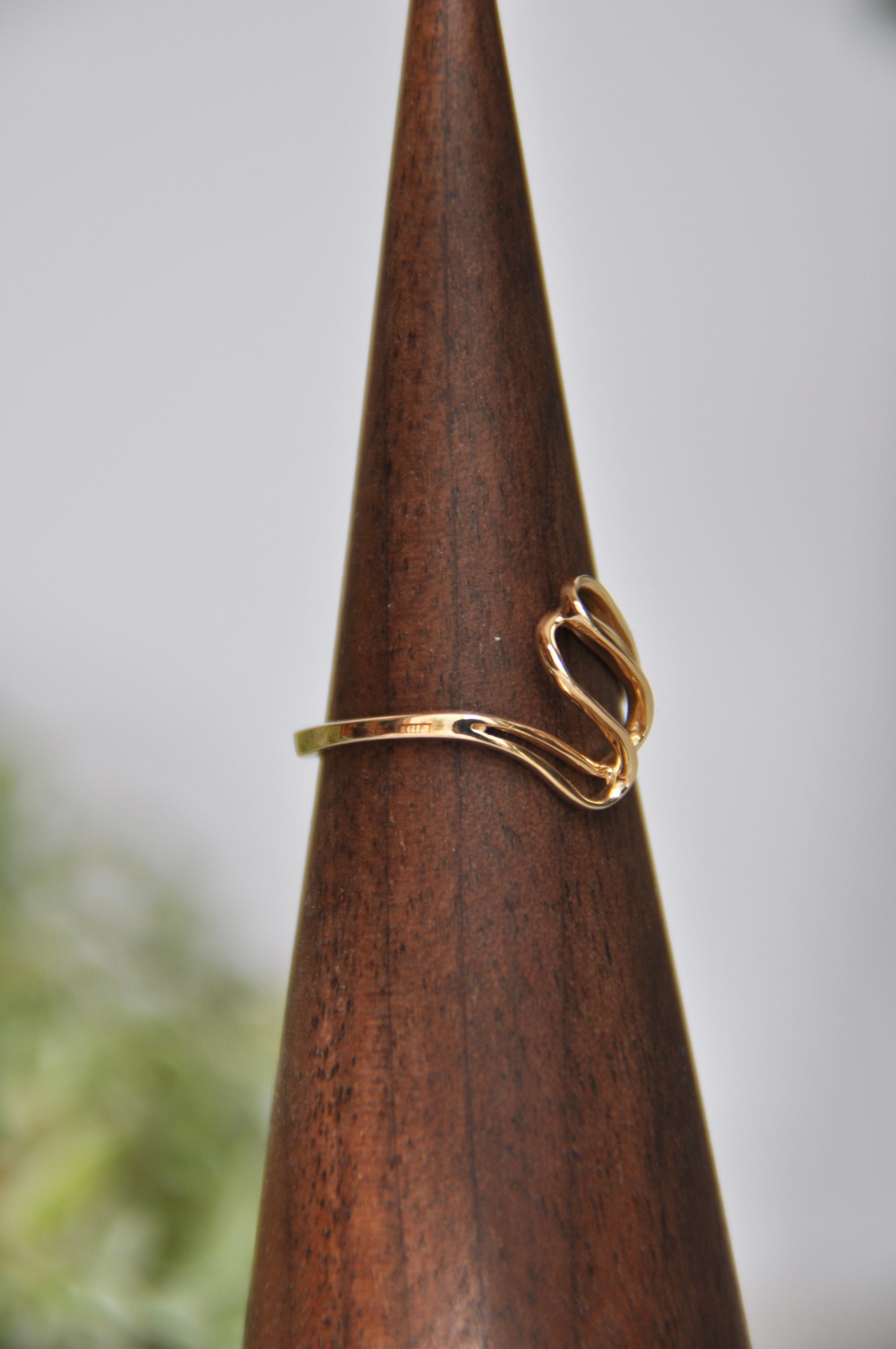 Freeform shaped ring with overlapping curves in 14kt yellow gold, size 6.5