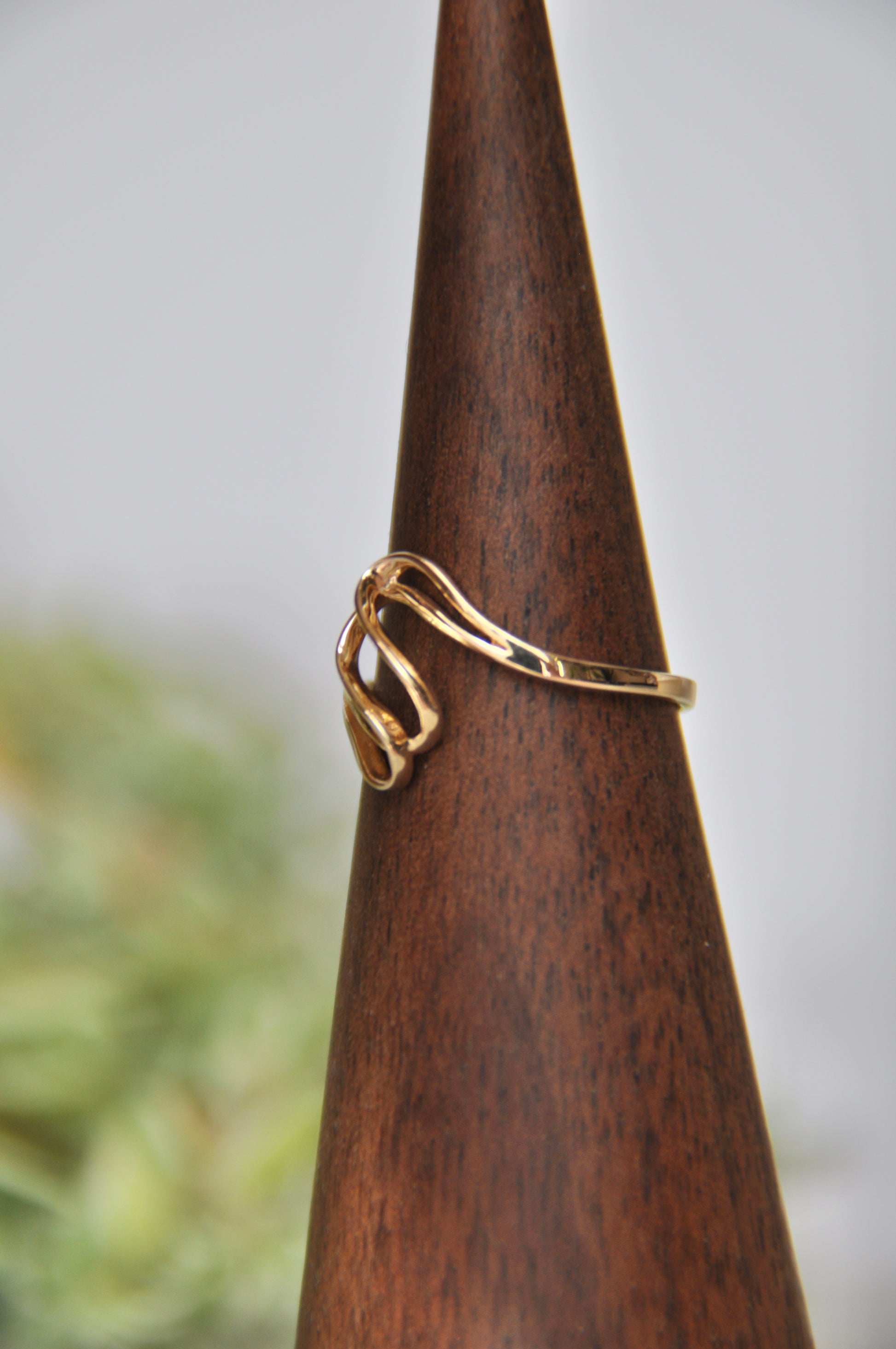 Freeform shaped ring with overlapping curves in 14kt yellow gold, size 6.5