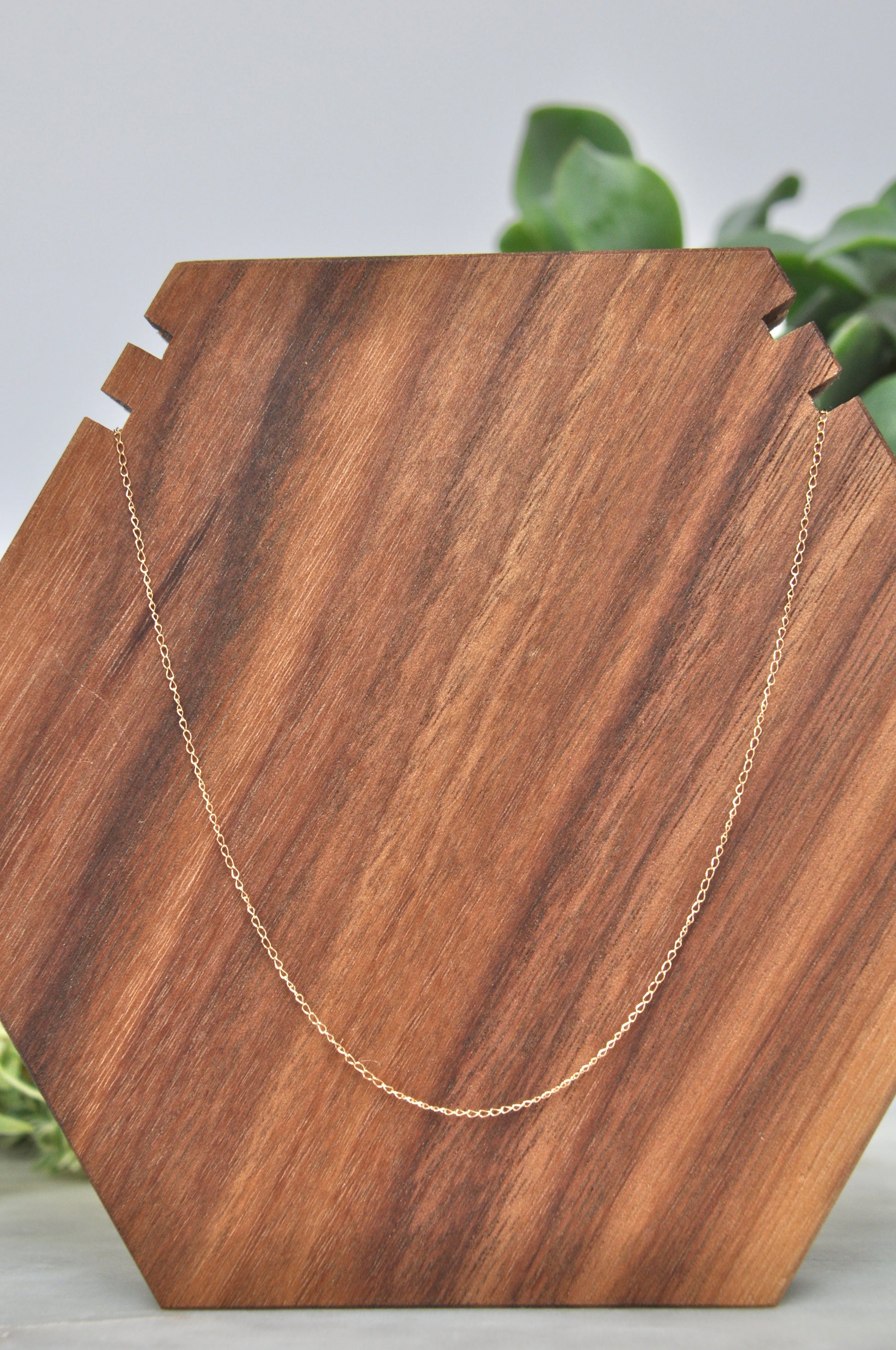 Flat cable chain necklace in 14kt yellow gold, 1mm thick, 18 inches long, with spring ring clasp