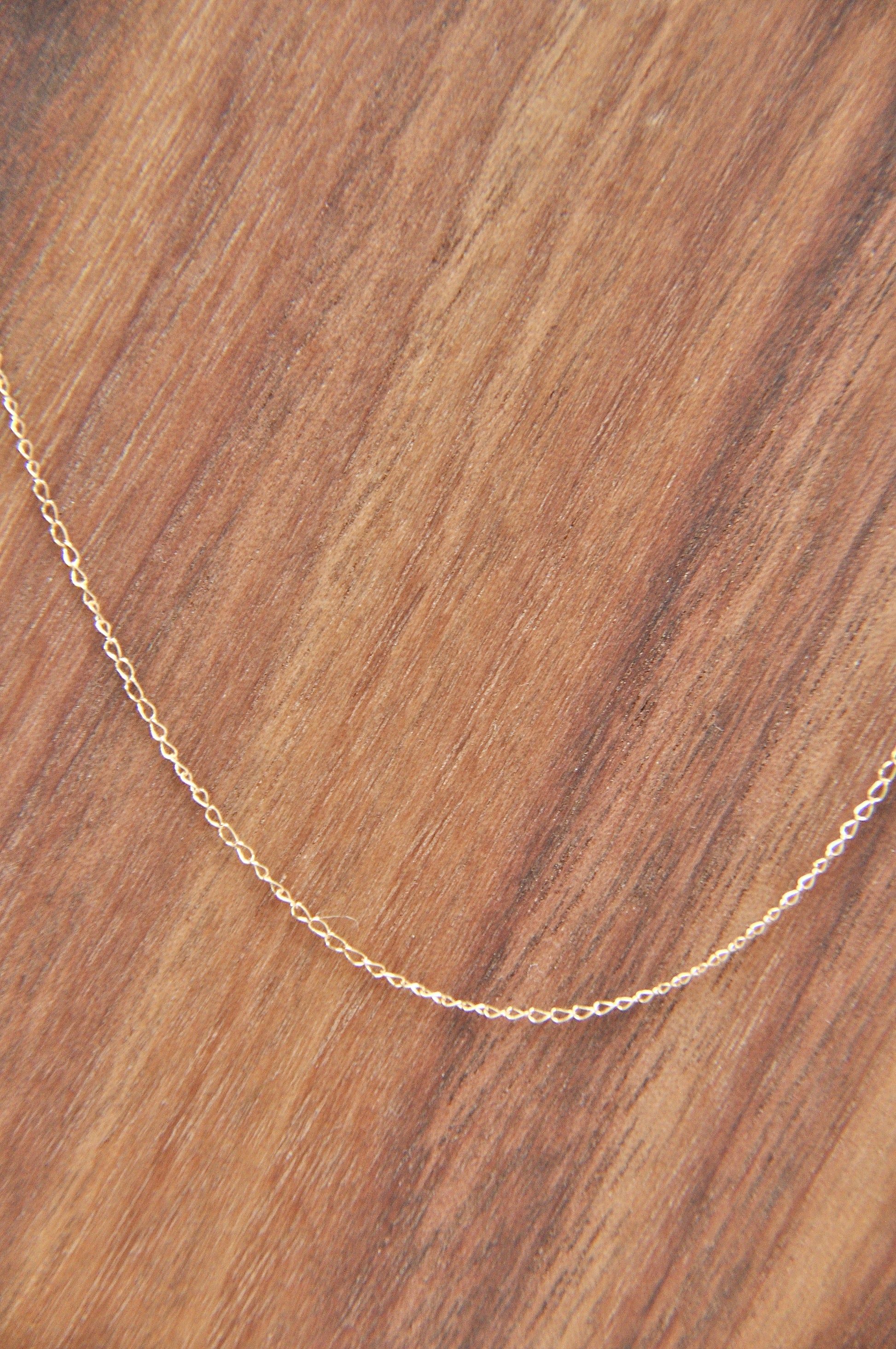 Flat cable chain necklace in 14kt yellow gold, 1mm thick, 18 inches long, with spring ring clasp