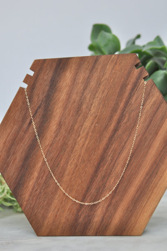 Curb chain necklace in 14kt yellow gold, 1mm thick, 18 inches long, with spring ring clasp
