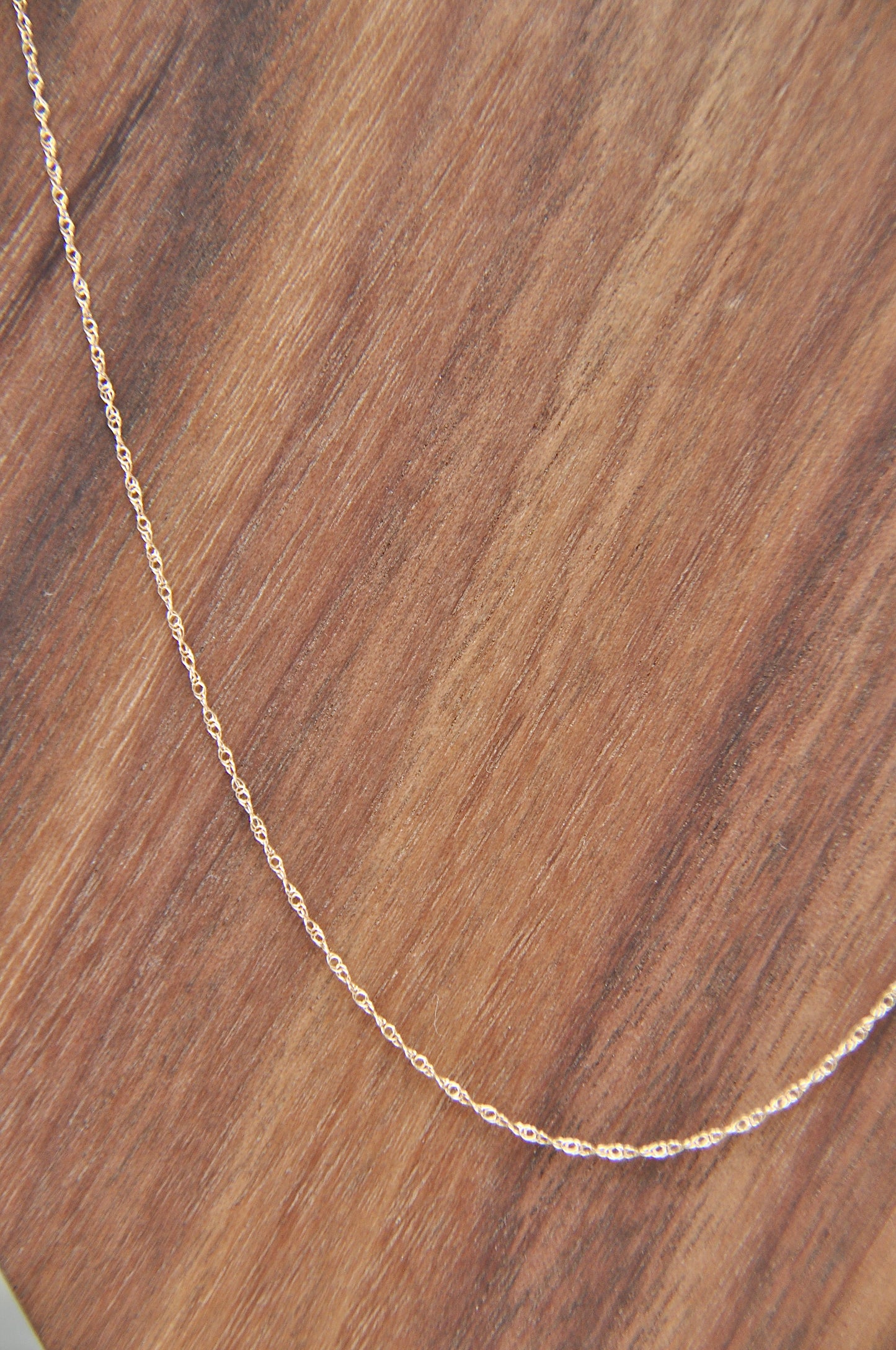 Rope chain necklace in 14kt yellow gold, .75mm thick, 18 inches long, with spring ring clasp