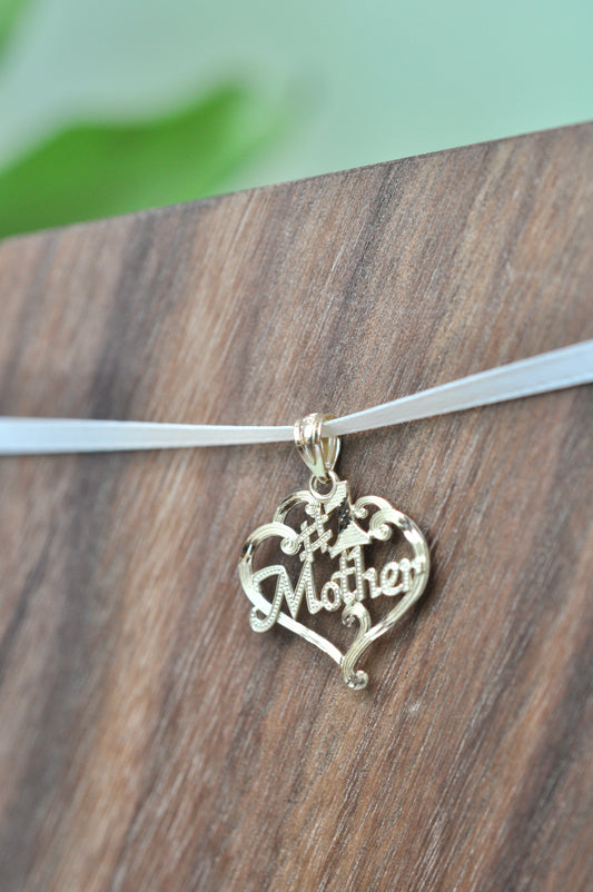 #1 Mother encased in heart with scroll detailing in 14kt yellow gold, approximately 17mm wide, 16mm long, 0.89g
